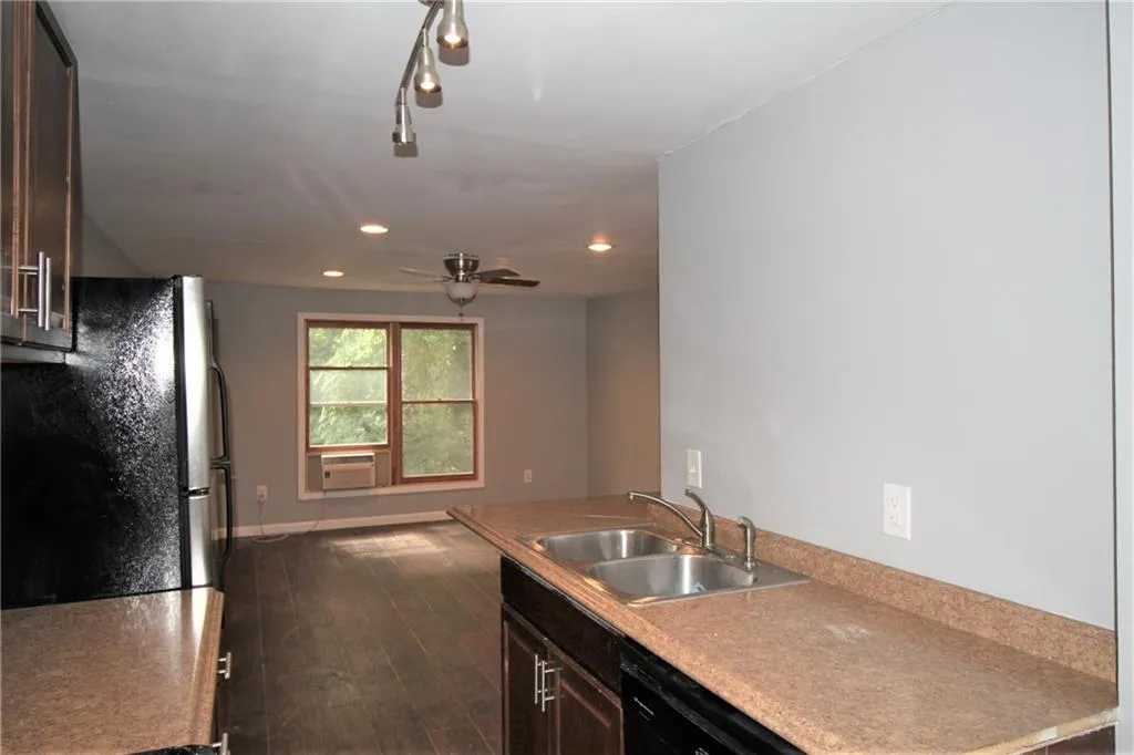 This vew shows the entire unit living/ bedroom space. bathroom is located just behind the kitchen sink wall