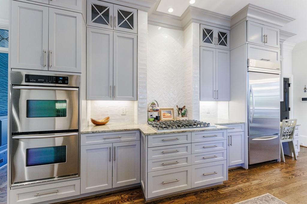 Another kitchen view featuring custom backsplash.