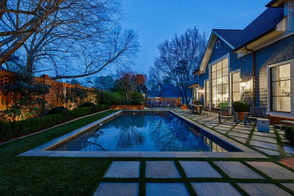 Pool at dusk with stone patio