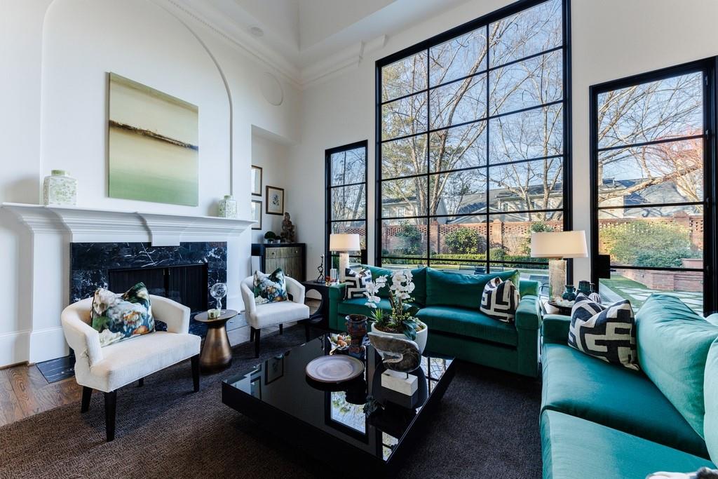 Great room features gas fireplace and steel windows