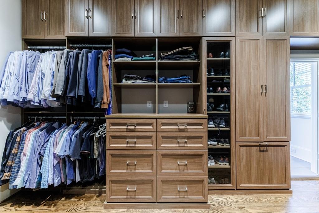 Primary closet with custom California cabinetry