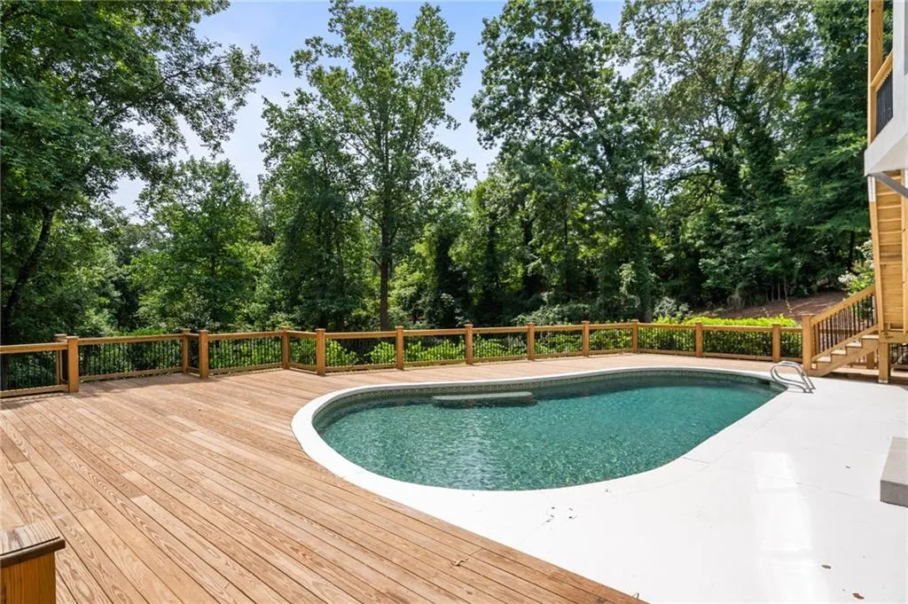 View of pool with a deck