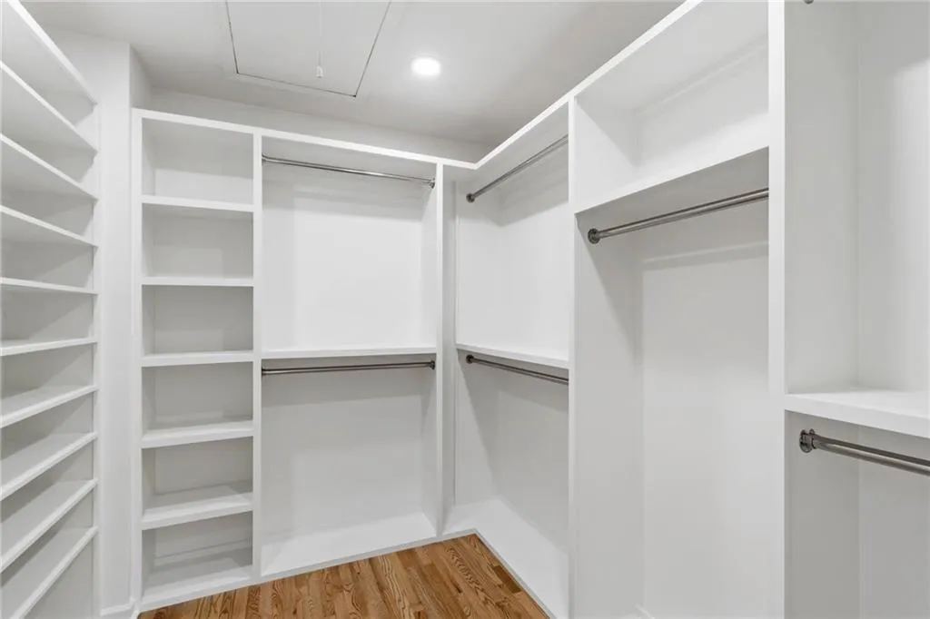 Walk in closet featuring hardwood / wood-style flooring