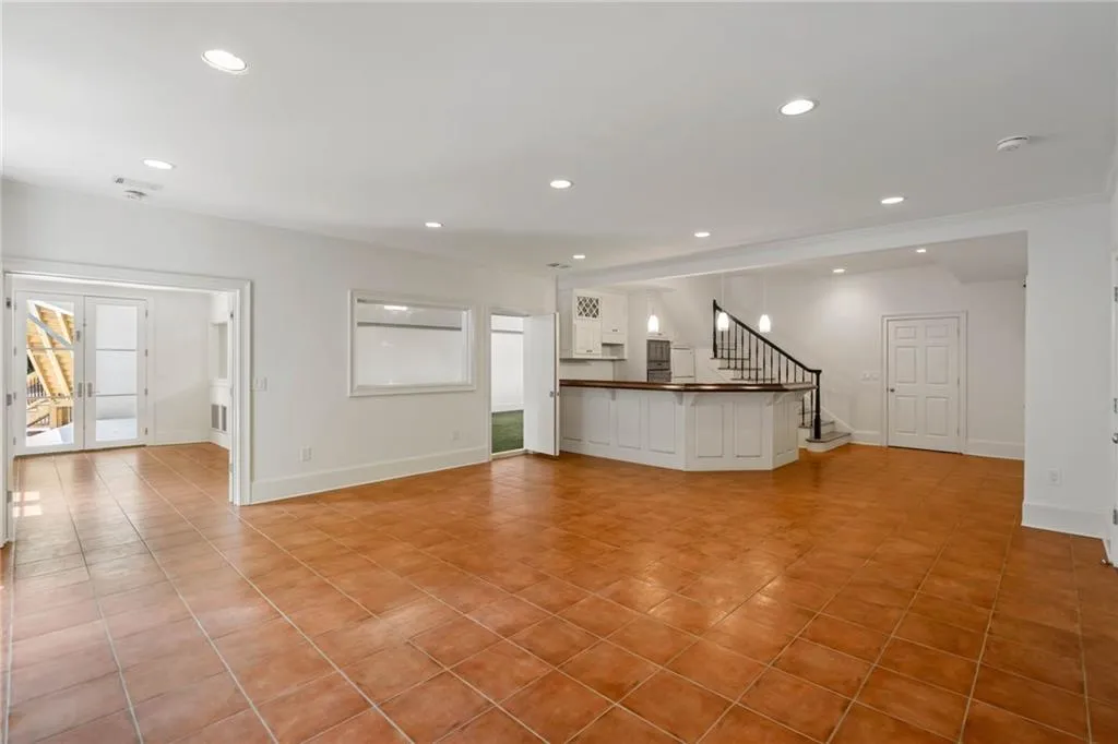 Unfurnished living room with light tile patterned floors