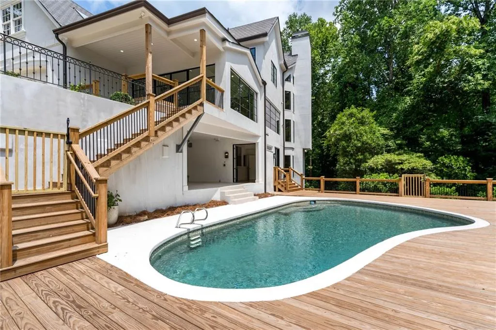 View of pool featuring a deck