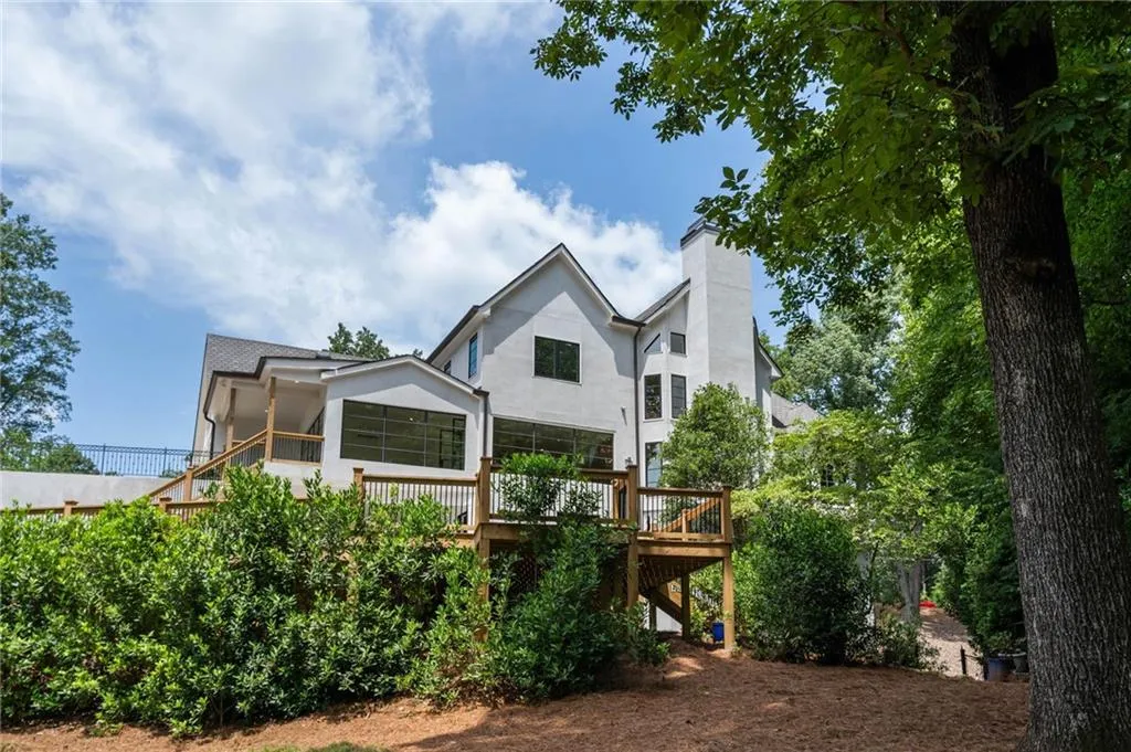 Rear view of property with a wooden deck