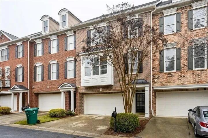 Brick exterior with black shutters and white window trim