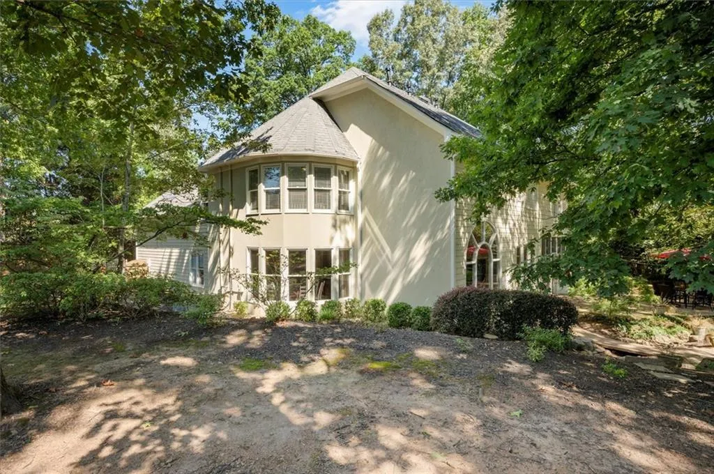 Back of house with stucco siding