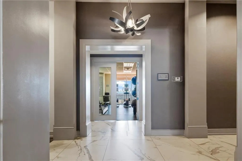 Corridor to gym, golf simulator and workshop.
