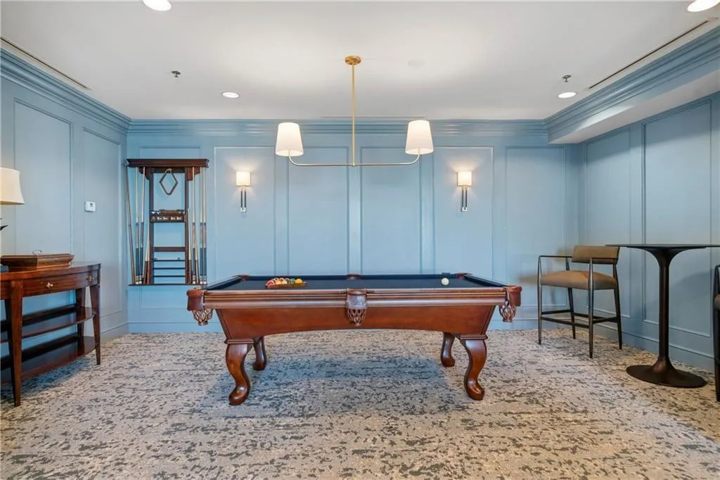 Recreation room with pool table and ornamental molding