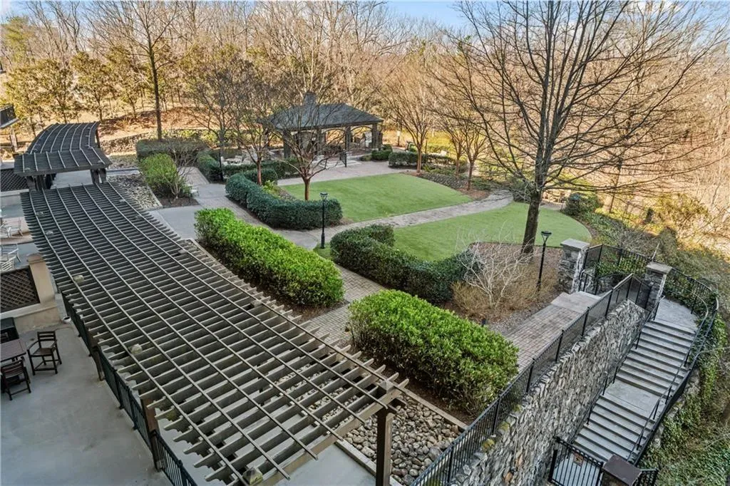 View of community featuring a lawn and a gazebo