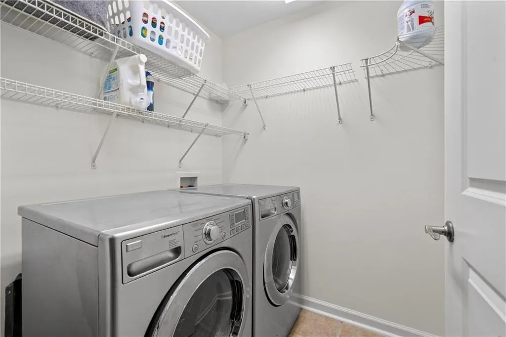 Spacious laundry room with plenty of room for storage.