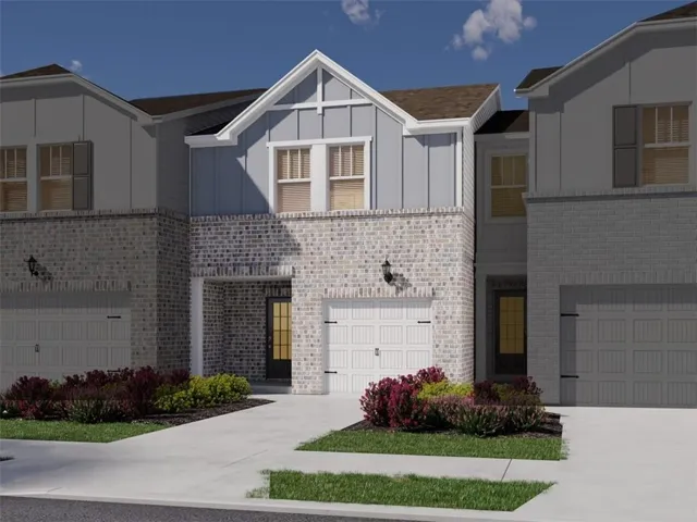 Two-story facade with light-colored brick and vertical siding accents