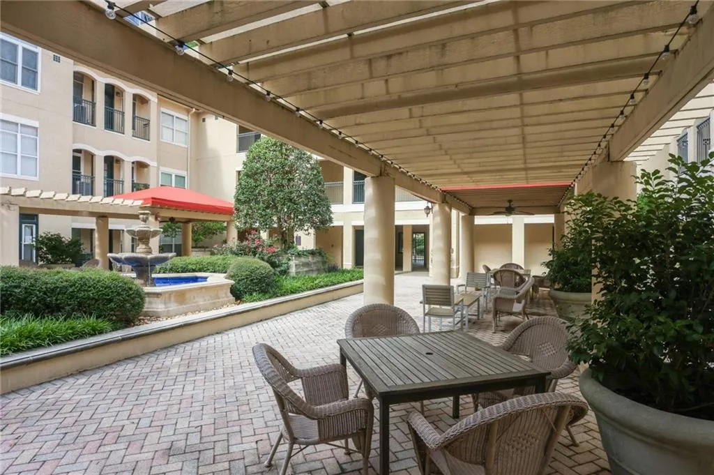 View of patio / terrace with outdoor dining area, a pergola, and a ceiling fan