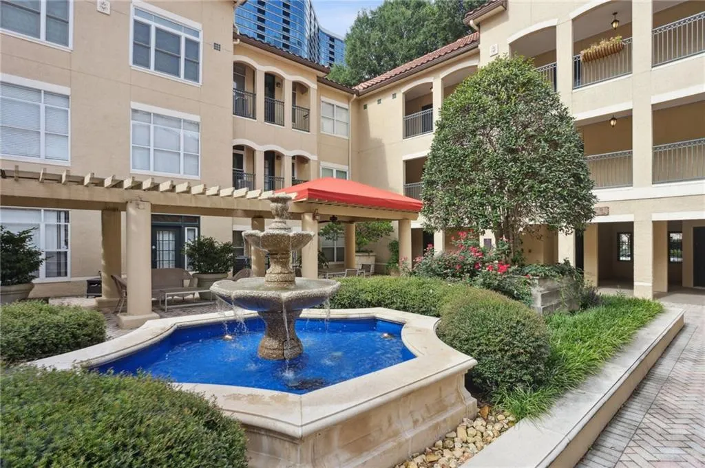 View of home's community featuring a pergola and a patio