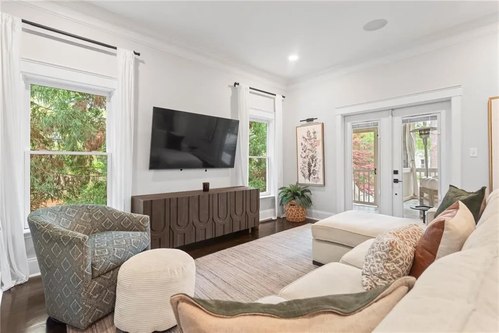 Just off the kitchen is the casual family room with double door to the incredible outdoor space