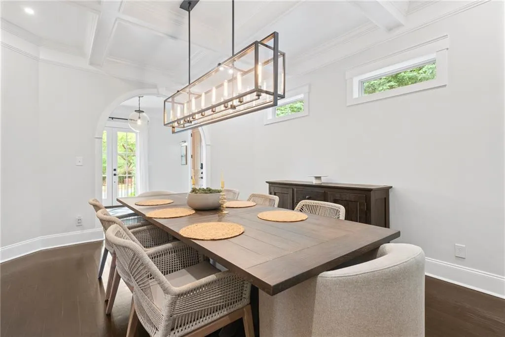 Cofferred ceiling, and trendy lighting. Transom windows adds natural light