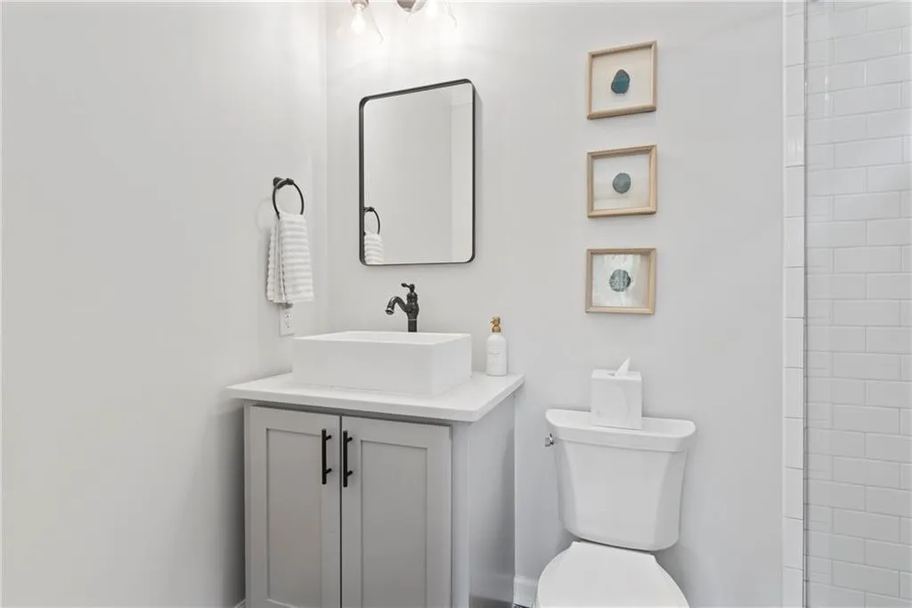 Both upstairs bedrooms are ensuite with great vessel sinks and shower heads.