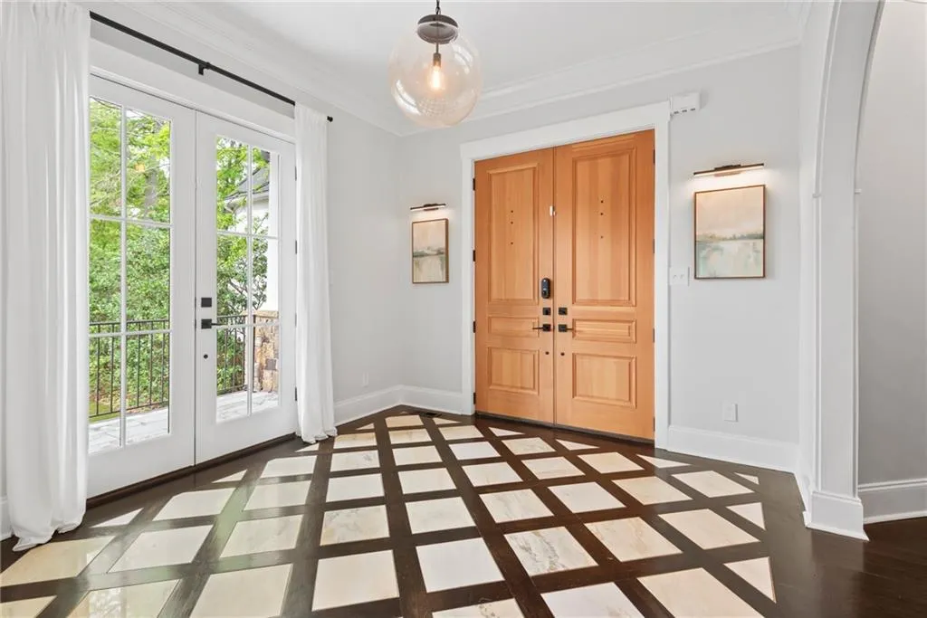 Access to a front balcony off the entry plus coat closet and curved entrance to dining room