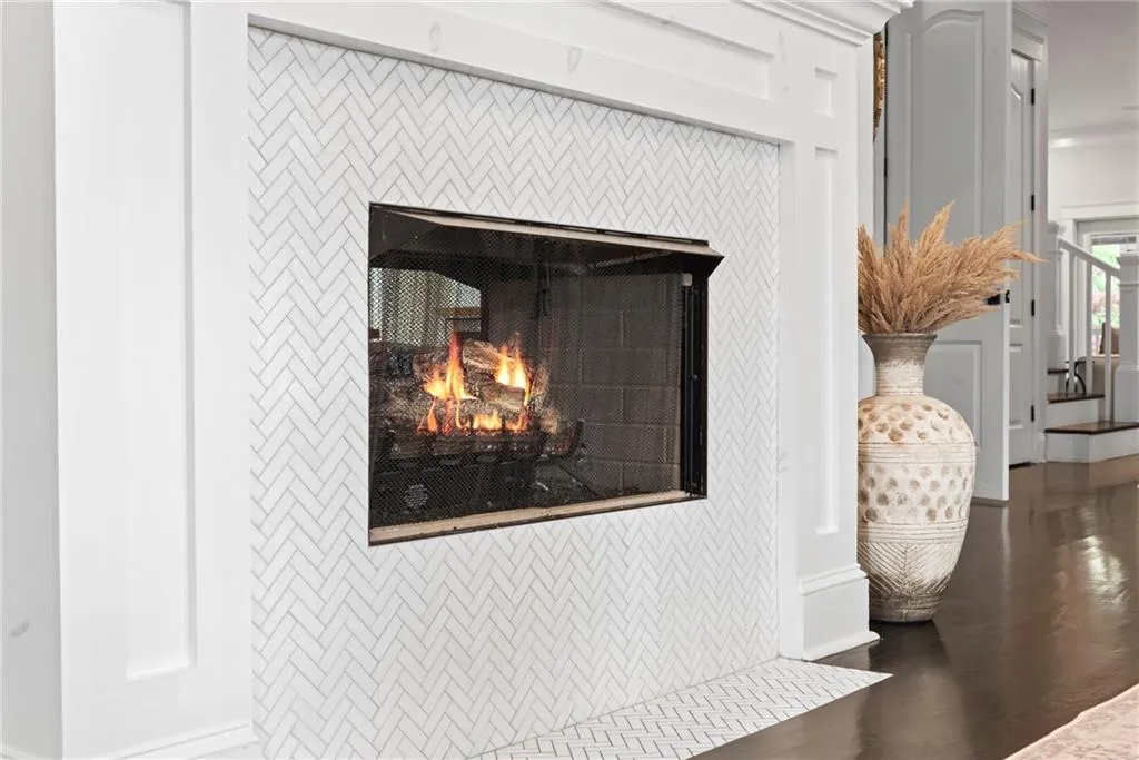 This remote ocntrolled gas fireplace provides ambiance for two rooms!