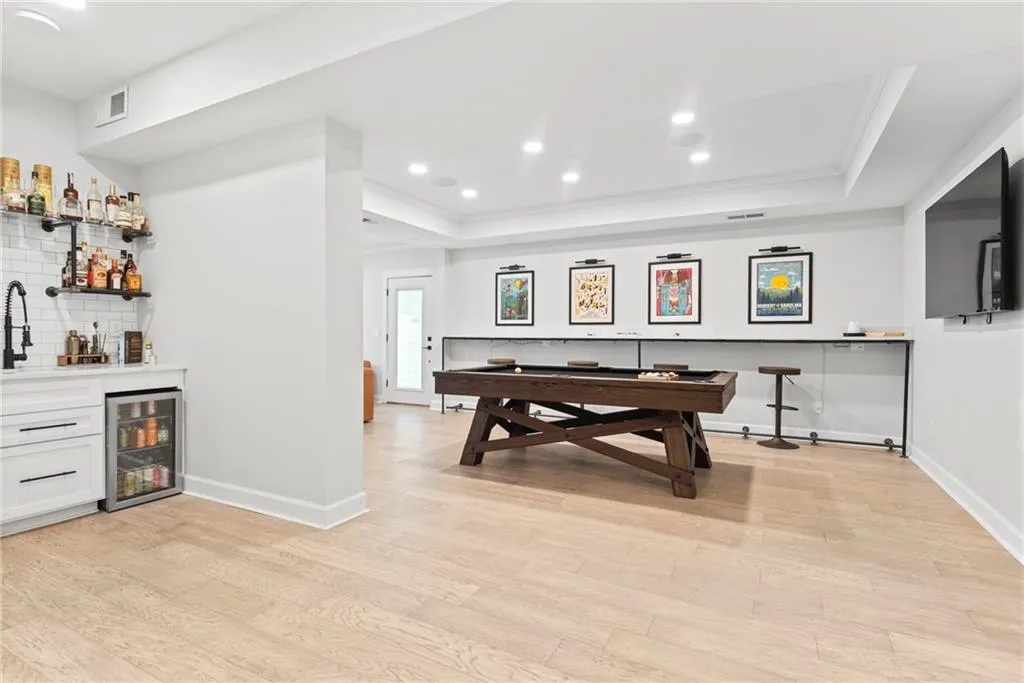 Game room has observation area and convenient wet bar