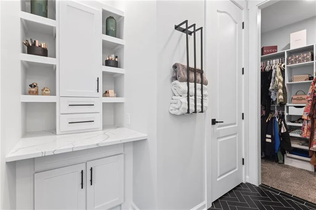 Lots of built in storage, private water closet and entrance to one of two walk in closets