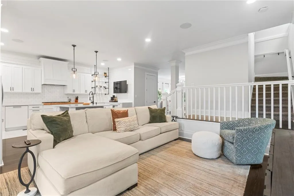 Family room just off the kitchen with ciew of the stairs.