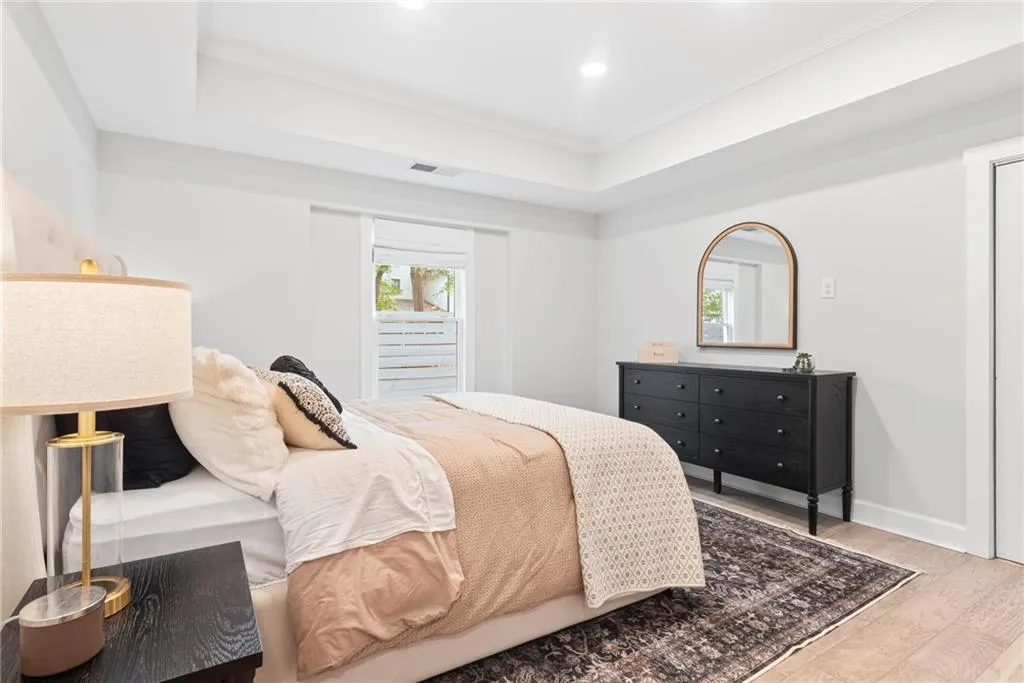 Terrace level bedroom has walk in closet and tray ceiling.