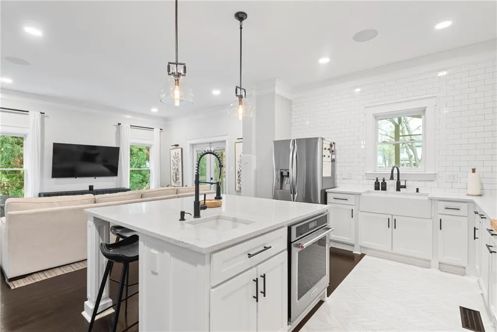 Just off the open kitchen is a view to the casual living or keeping room.