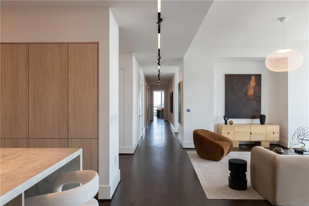 Gallery lighting down hall offers pinpoint to spotlight lighting creating the perfect aesthetic for your art collection.