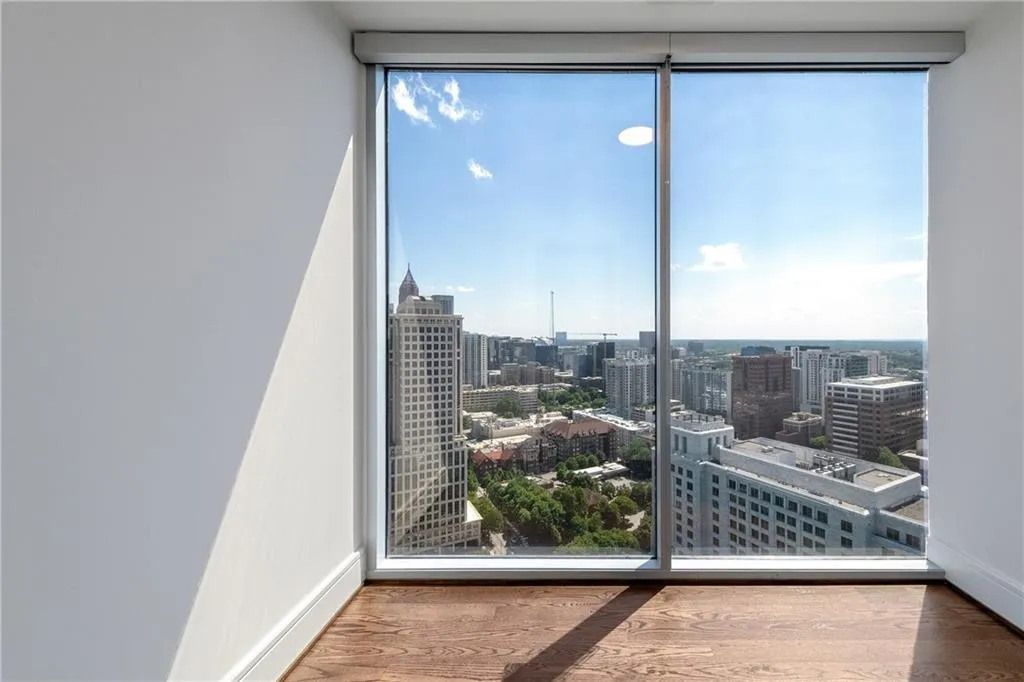 Guest room closet with floor to ceiling windows provide lots of natural light.
