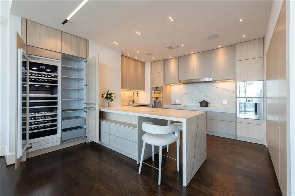 Three zoned wine chiller stores your favorite wines, perfectly positioned for entertaining.