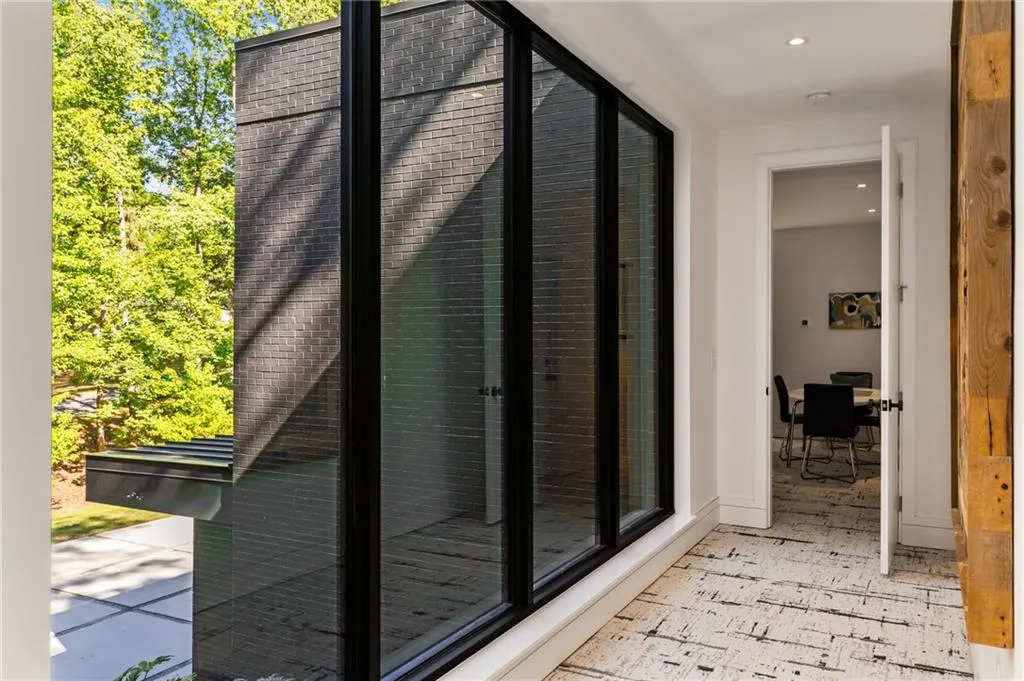 Corridor with light tile flooring