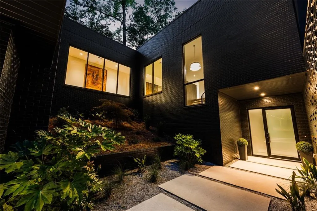 View of property exterior at dusk