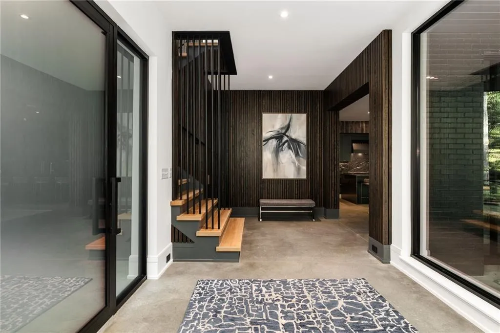 Entryway featuring wooden walls