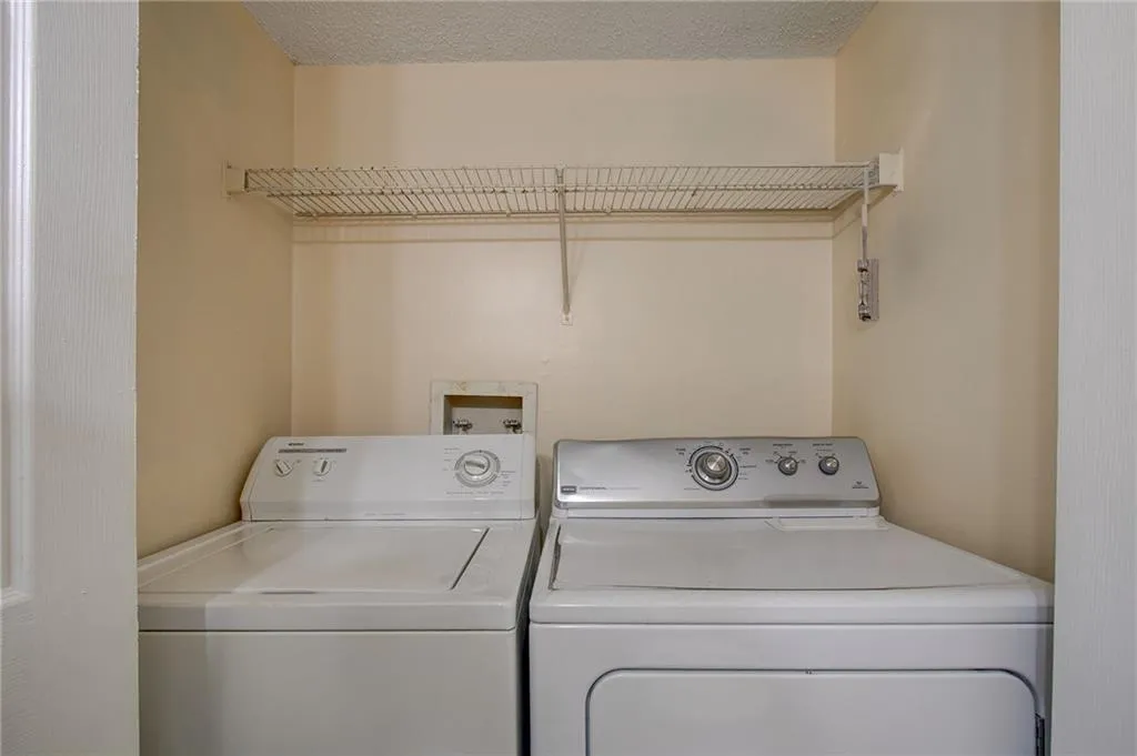 Laundry room featuring separate washer and dryer