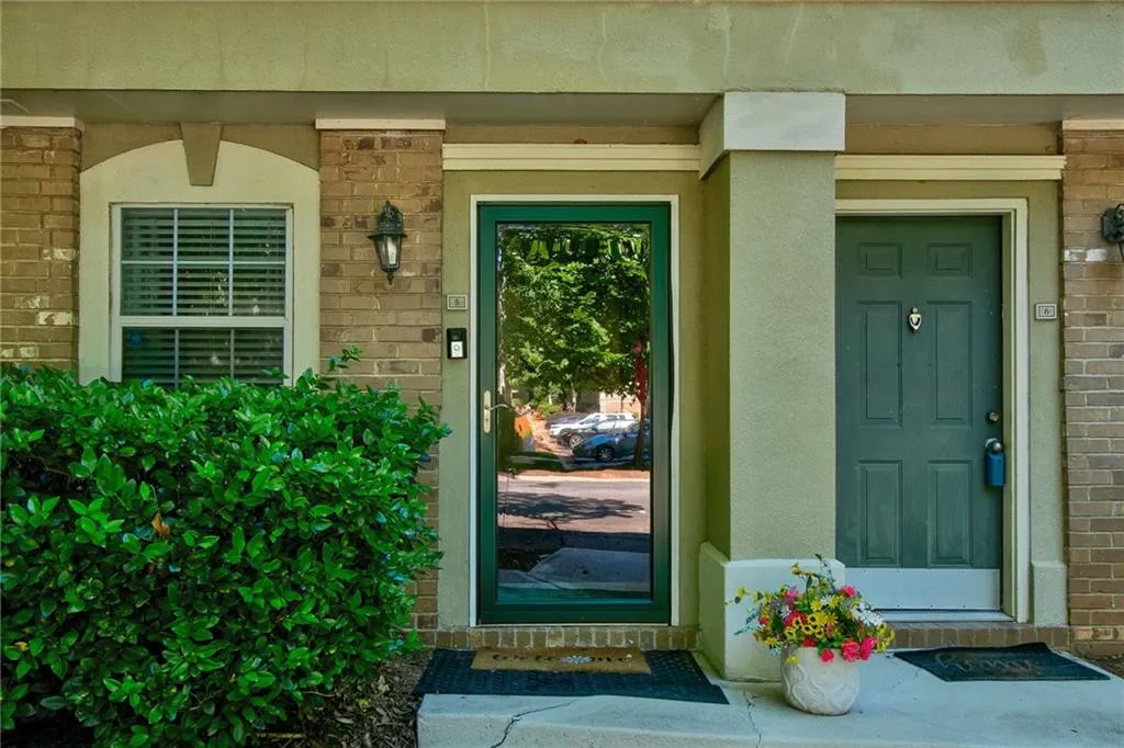 View of exterior entry with a porch