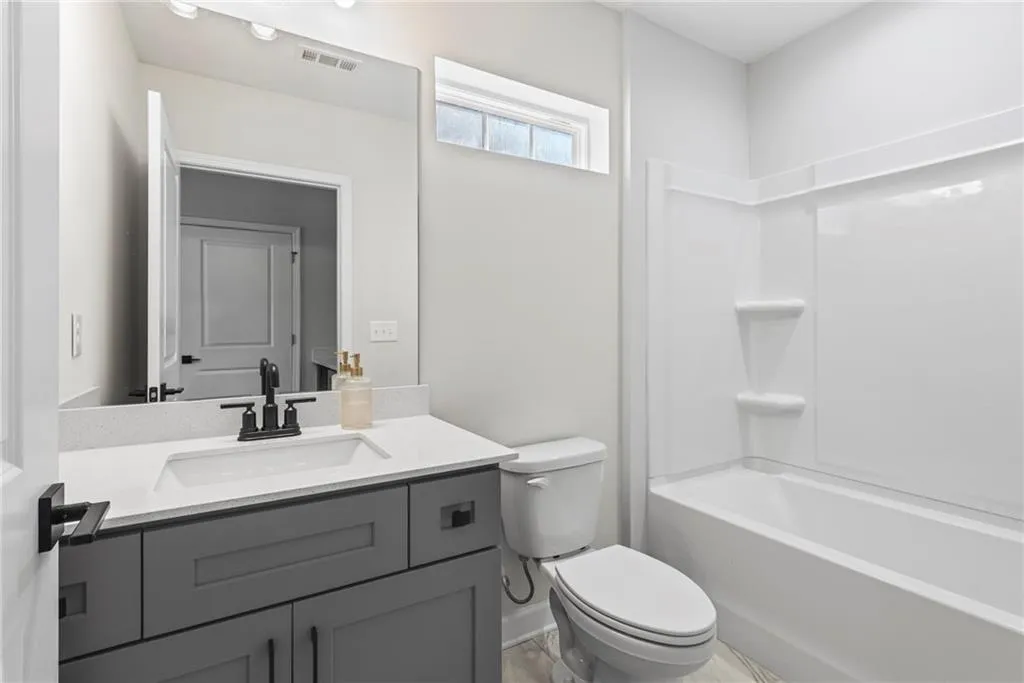 Full bathroom with vanity and tub / shower combination