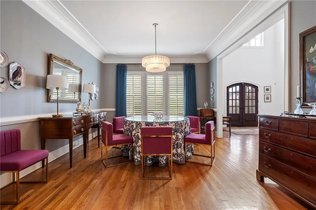 Living area featuring crown molding, light hardwood / wood-style flooring, french doors, and plenty of natural light