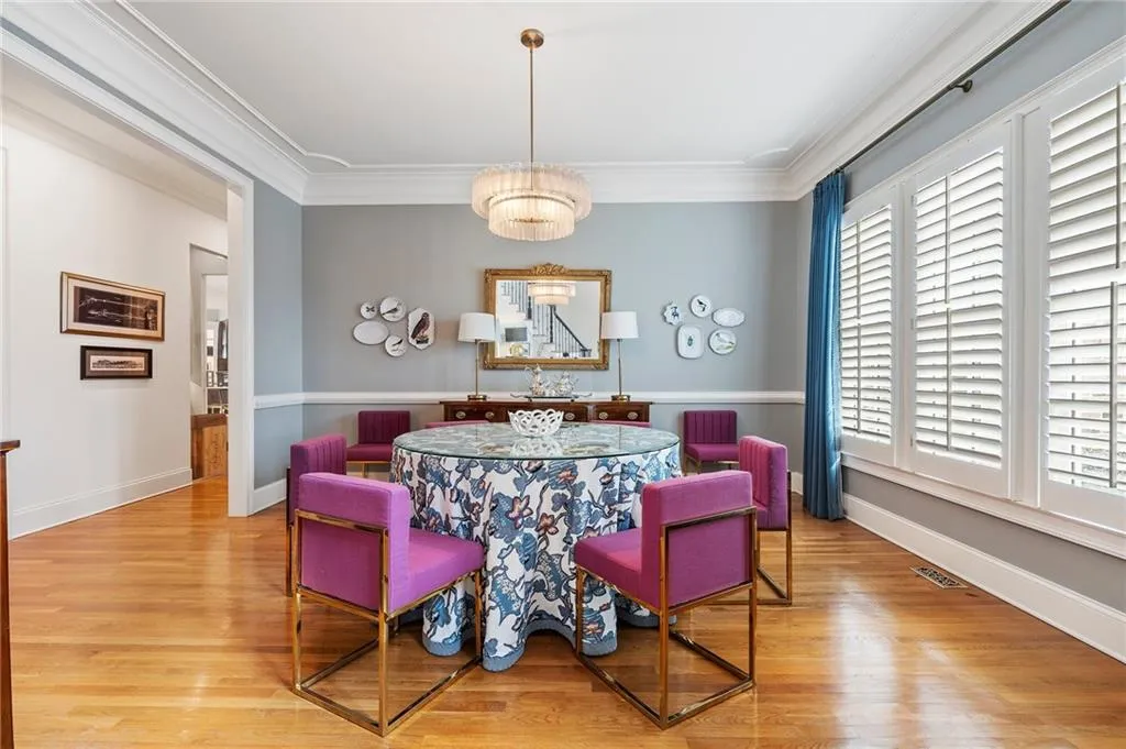 Dining space featuring crown molding and light wood-type flooring