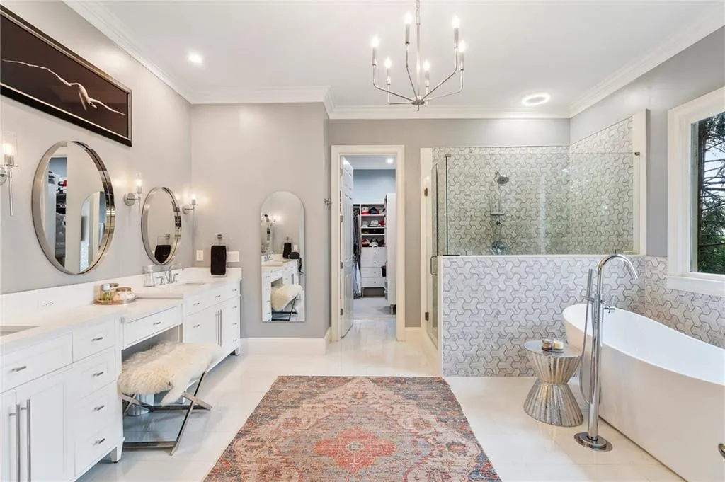 Bathroom featuring crown molding, vanity, shower with separate bathtub, and tile patterned flooring