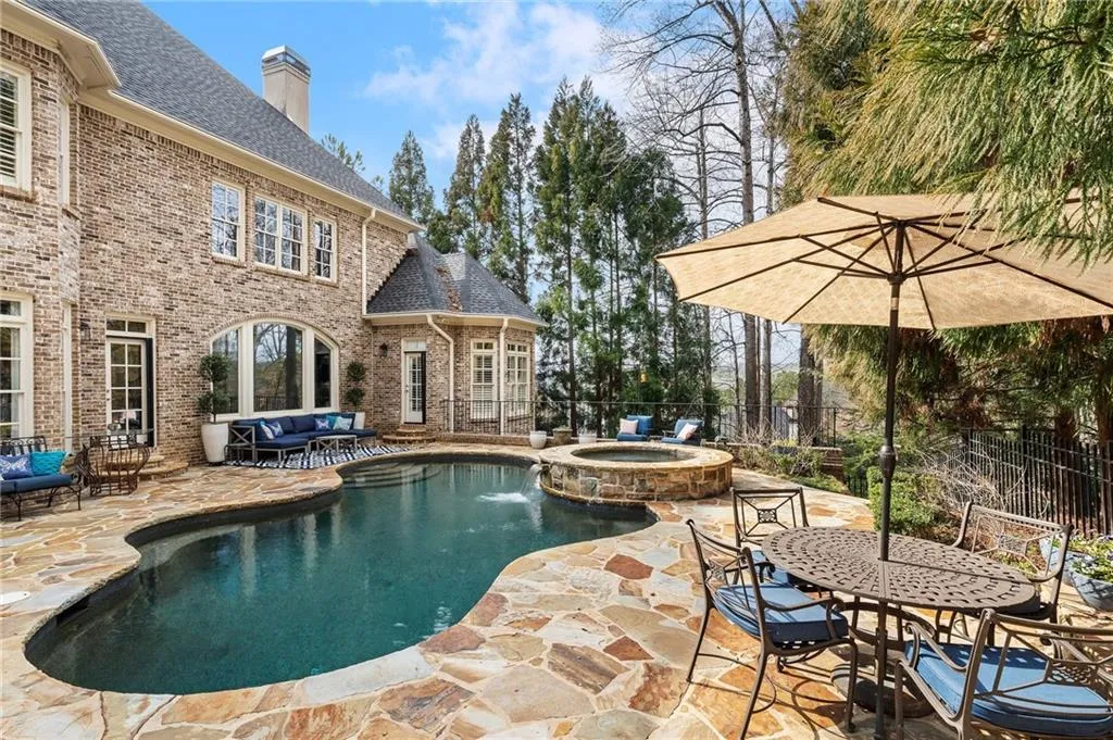 View of swimming pool featuring an in ground hot tub, an outdoor living space, and a patio