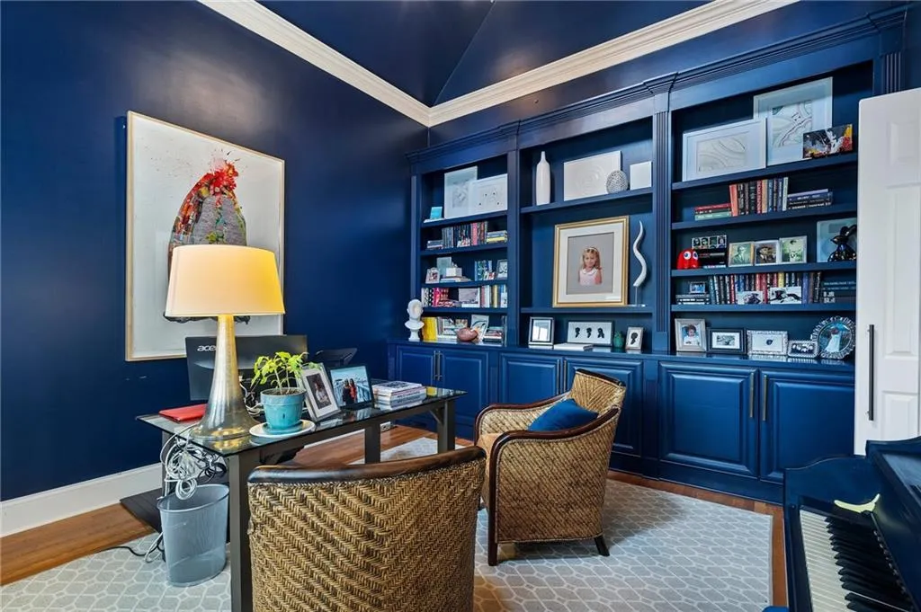 Sitting room with lofted ceiling and hardwood / wood-style flooring