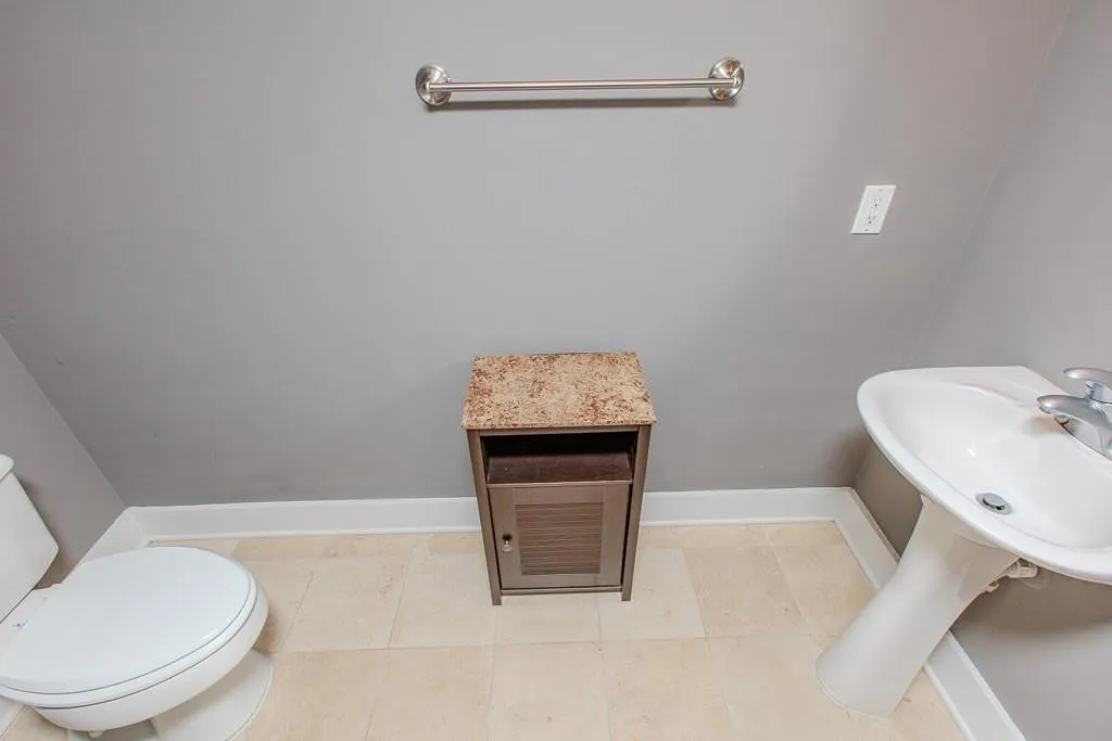 Bathroom with tile floors and toilet Bathroom with tile floors and toilet
