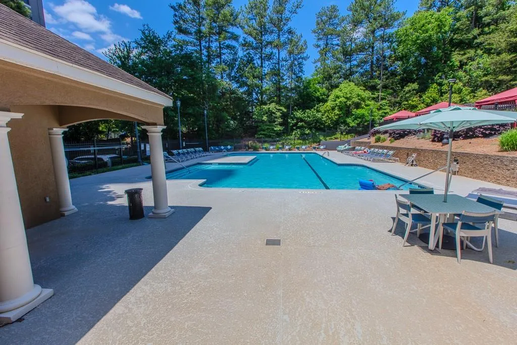 View of swimming pool featuring a patio area View of swimming pool featuring a patio area