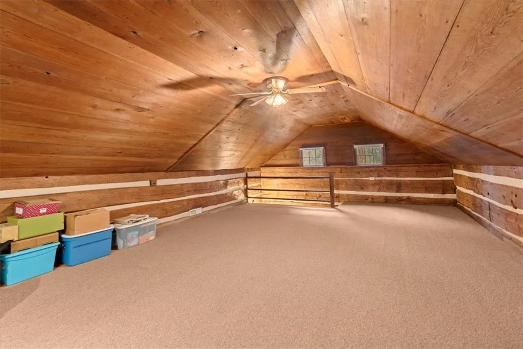 The second story of the log cabin is one big bonus room