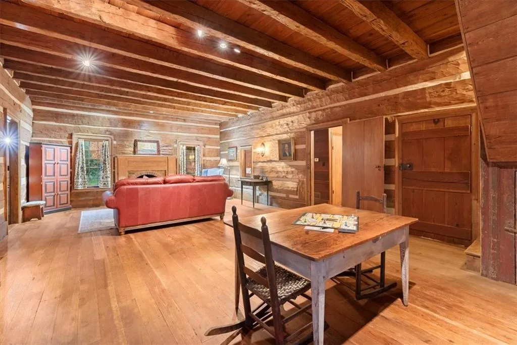Two rooms were combined into one enormous family room in the log cabin addition