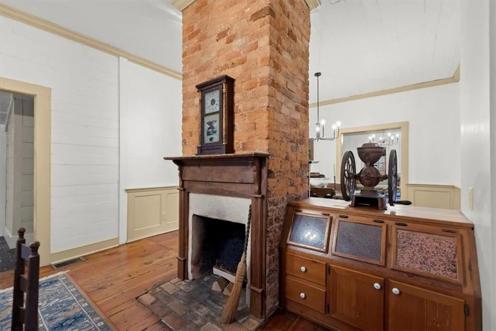 Two sided fireplace connects dining room and kitchen