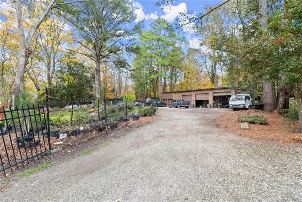 5 car garage and second driveway currently used by the owner's landscaping business