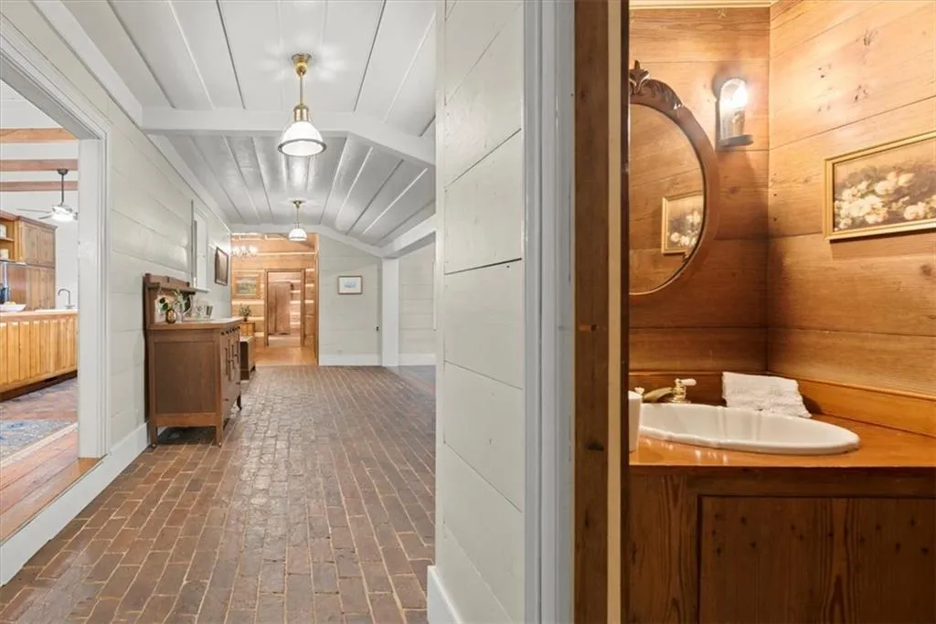 Charming half bath adjacent to sunroom